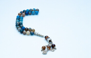 Rosary or prayer beads, isolated on white background	
