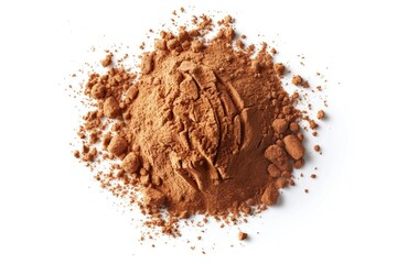 A heap of brown cocoa powder sits on a white surface, perfect for baking or decorating