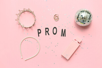 Word PROM with crown, disco ball and perfume bottle on pink background