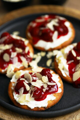 Open sweet sandwiches with cherries