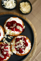 Open sweet sandwiches with cherries