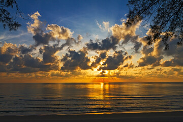 Sunrise on water in morning  at beach