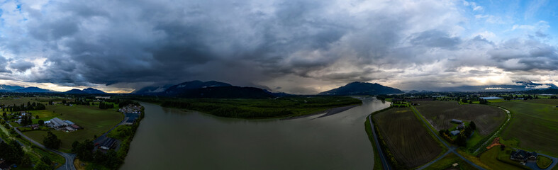 Obraz premium Dramatic Stormy Cloudscape over Canadian Nature Landscape.
