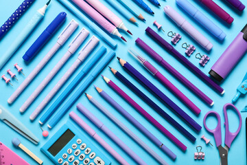Obraz premium School supplies on turquoise background. Top view