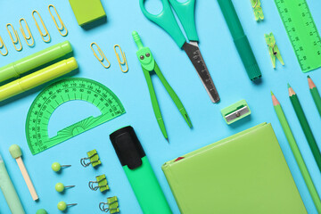 School supplies on turquoise background. Top view