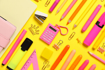 School supplies on yellow background. Top view