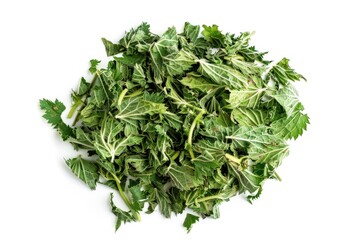 Fototapeta premium A pile of leafy greens on a white surface
