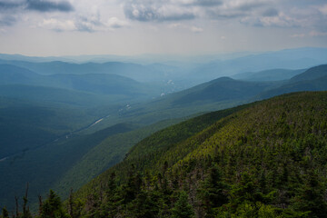 Mountaintop photograph with a misty valley