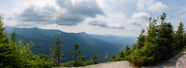 Mountaintop panorama with a misty valley