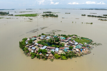 Aerial view showcasing the devastating impact of floods on villages in Northern Bangladesh, highlighting the submerged homes, affected communities, highlighting the severe impact and the resilience