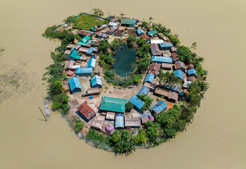 Aerial view showcasing the devastating impact of floods on villages in Northern Bangladesh, highlighting the submerged homes, affected communities, highlighting the severe impact and the resilience