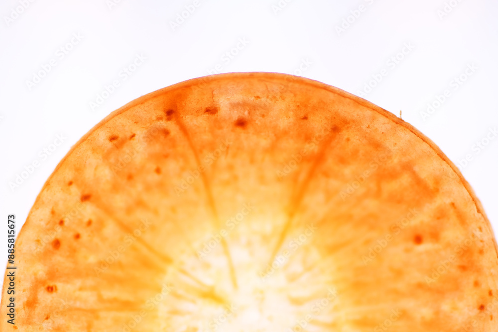 Wall mural macro shot of carrot sliced texture on white background