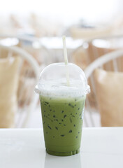 Iced green tea on a table in a cafe