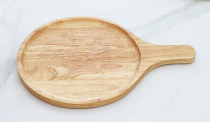 wooden tray placed on tiles