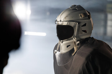 Fototapeta premium hockey goalie in the arena in a helmet without a face