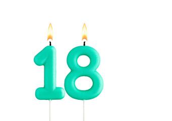 Green birthday candle on white background - Candle number 18