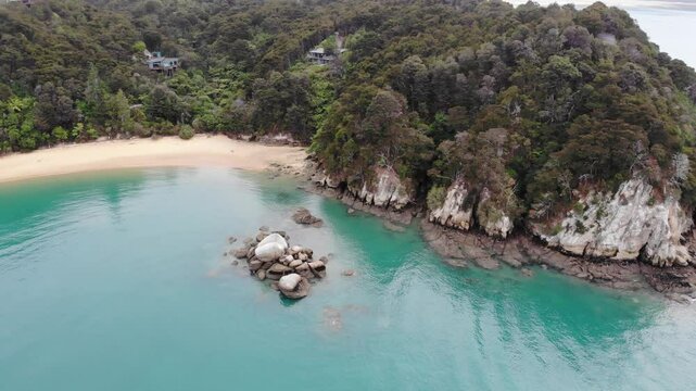 aerial panorama of split apple beach (towers bay) - famous bay with unique geological formation near abel tasman national park, new zealand south island