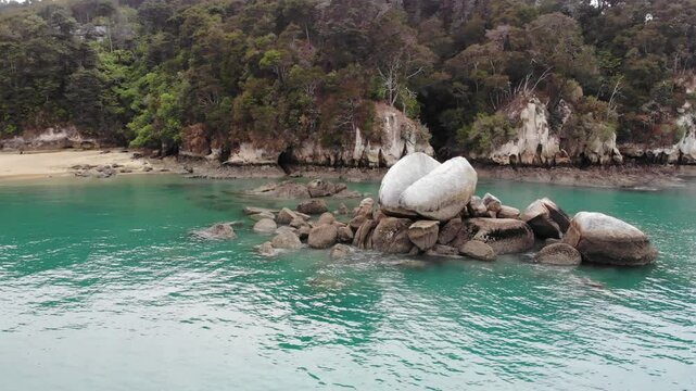 aerial panorama of split apple beach (towers bay) - famous bay with unique geological formation near abel tasman national park, new zealand south island