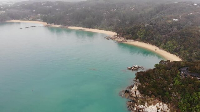 aerial panorama of split apple beach (towers bay) - famous bay with unique geological formation near abel tasman national park, new zealand south island