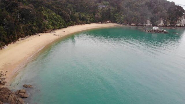 aerial panorama of split apple beach (towers bay) - famous bay with unique geological formation near abel tasman national park, new zealand south island