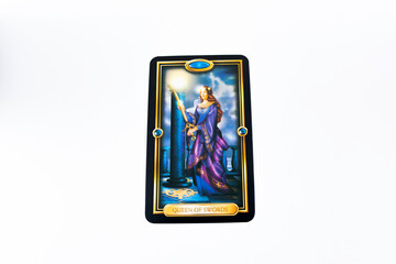 Fototapeta premium Tarot cards, Waite Rider tarot cards, the queen of swords card in the foreground on a background of available deck cards
