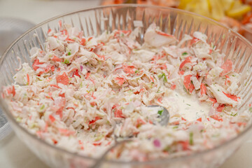 Imitation crab salad, salad with crab sticks in a bowl. © Tanya