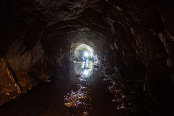 Dark abandoned mine in backlight