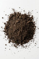 A pile of dirt on a clean white surface