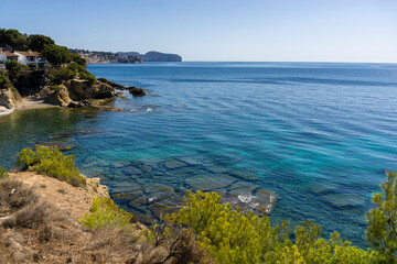 Fototapeta premium Capture the serene beauty of Benissa's ecological walk in the province of Alicante, Spain. This stunning image showcases a scenic path perfect for travel guides and blogs, offering a glimpse into the