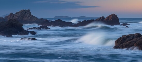 Ocean Waves Crashing Against Rocky Coastline at Sunset