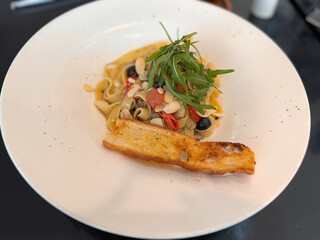 seafood pasta in ceramic plate