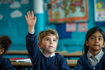 Three primary school students in the classroom with raised hands, eagerly waiting to answer the teacher’s questions, showcasing an engaged learning environment and enthusiasm for education.
