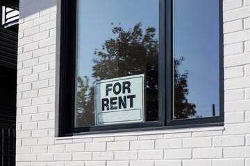 For Rent sign on window of a building window