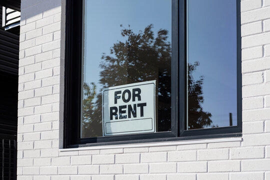 For Rent sign on window of a building window