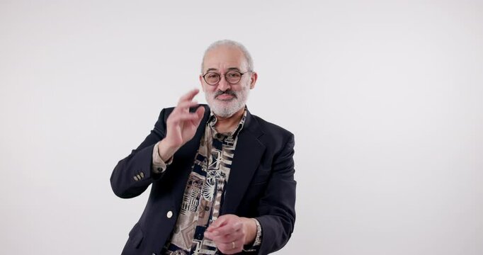Studio, senior man and face with dancing, moving and rhythm for creative steps with hands on air. Old man, dancer and cheerful in retirement with samba, tango and performance by white background