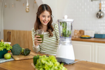 Portrait of beauty healthy asian woman making green vegetables detox cleanse and green fruit...