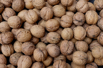 a pile of walnuts laying down on top of each other