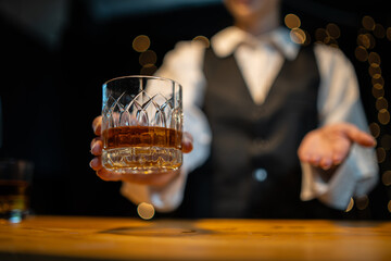 Barwoman pouring whiskey whiskey glass beautiful night