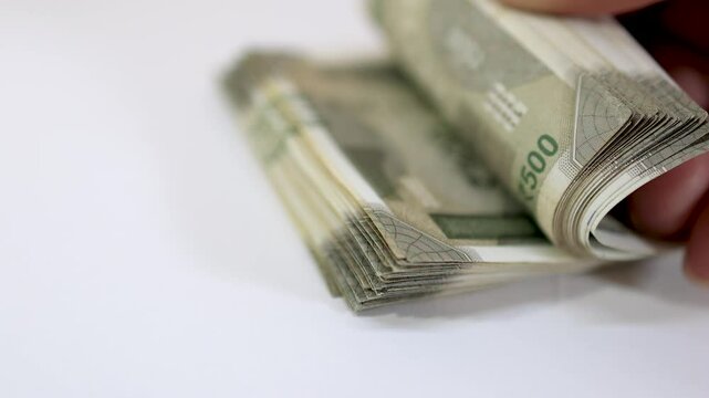 Close up view of flipping Indian 500 rupees pack, Budget concept .