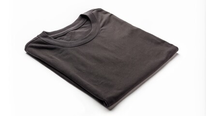 Simple cotton black t-shirt folded and isolated on a clean white background with creases and folds visible.