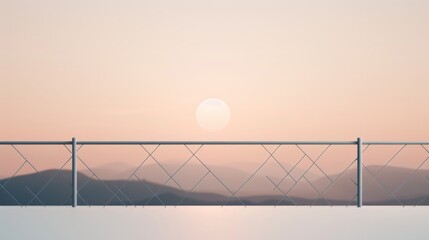Serene sunset over mountains seen through a simple railing. Captures nature's beauty and tranquility in a minimalist style.