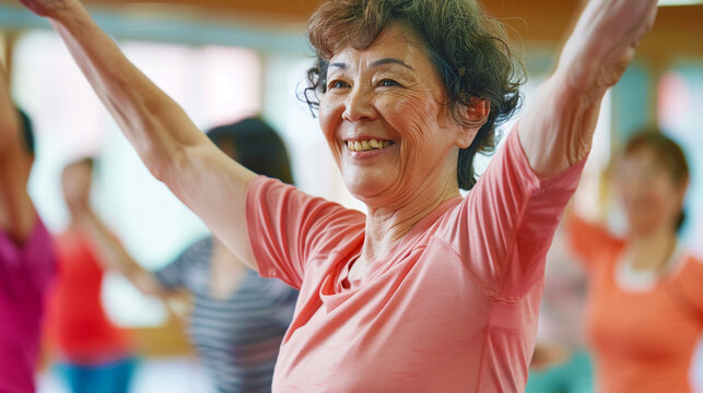 Senior women dancing together in gym cla