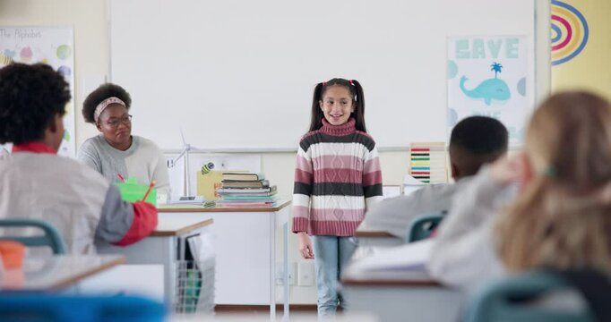 School, education and child talking in classroom for lesson, learning and oral assessment. Presentation, students and kids listen to girl for public speaking, speech development and show and tell
