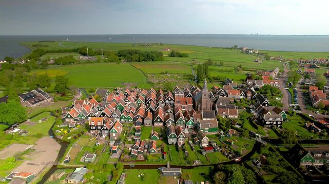 Aerial view of scenic Marken island landscape with colorful homes and church in The Netherlands.