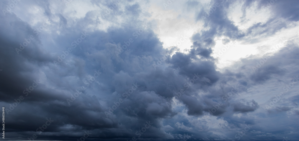 Poster the dark sky with heavy clouds converging and a violent storm before the rain.bad or moody weather s