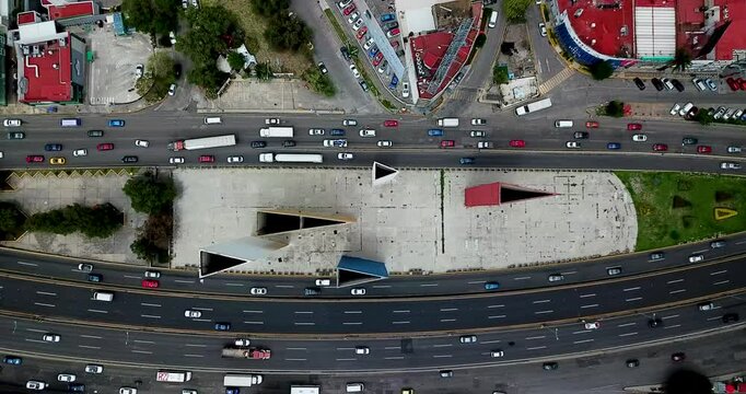 Overhead shot of the Sat&eacute;lite towers, on the outskirts of Mexico City, at noon on a cloudy day with little traffic