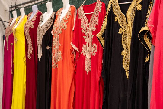 Colorful, richly embroidered Arabic kaftans at a market