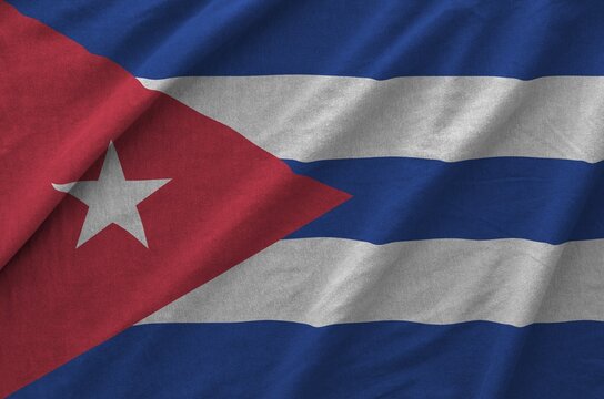 Cuba flag depicted on folded wavy fabric of old cloth close up