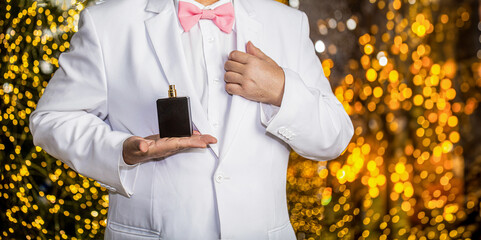 Fashion cologne bottle. Rich man prefers expensive fragrance smell. Man spraying luxury perfume....
