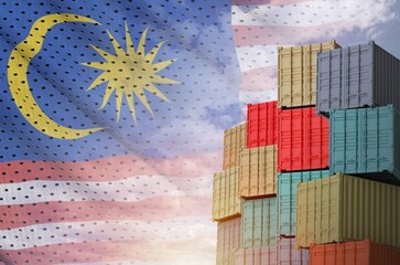 Malaysia flag and big stack of shipping cargo containers in docks with sky background close up